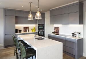 Valley White Quartz Worktop, Wall Cladding, Mitred End Gables & 60mm Mitred Downstands on Island